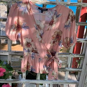 Pink peplum top with Magnolia pattern